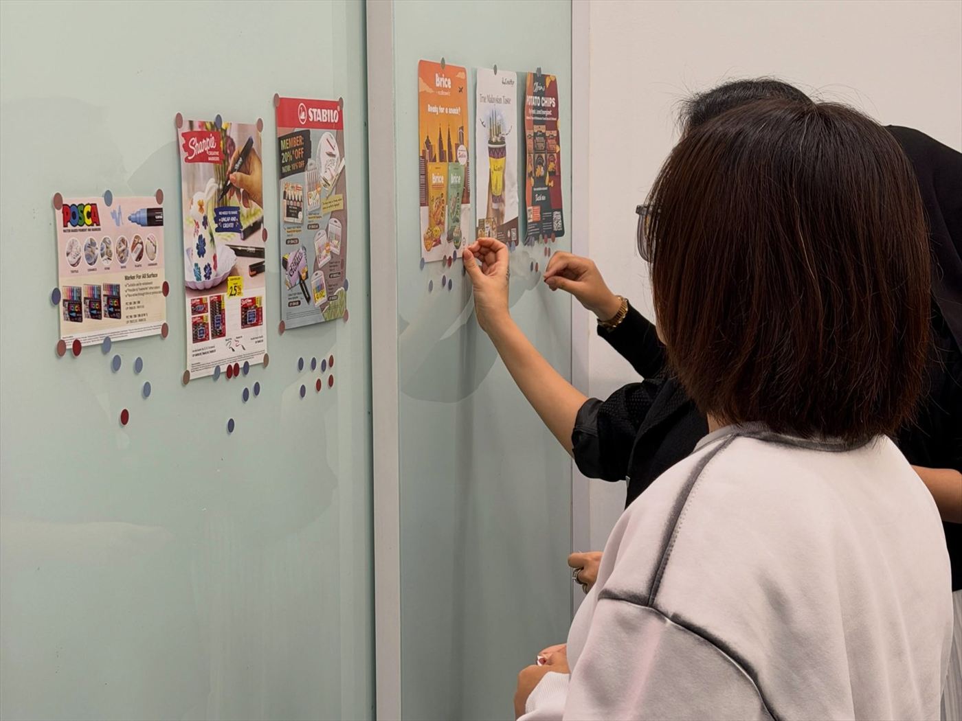 Participant rating campaign work on the wall